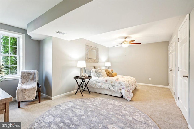 bedroom featuring carpet flooring, baseboards, and a ceiling fan