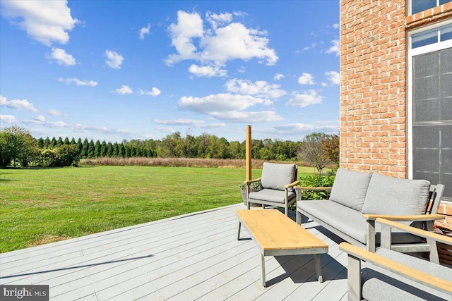 deck with an outdoor living space and a lawn