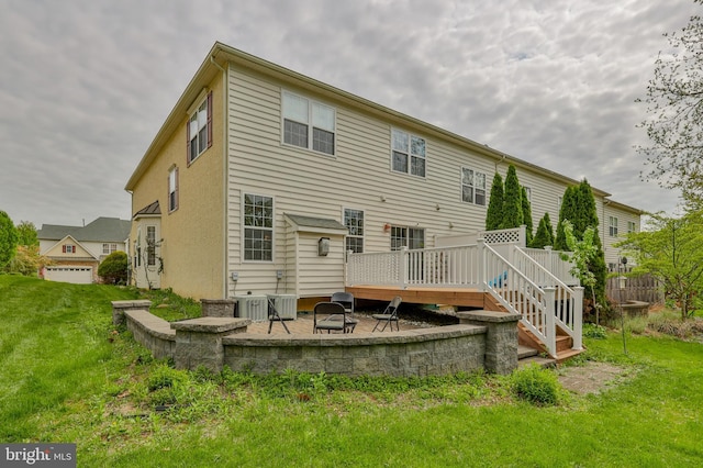 rear view of property with a patio, a wooden deck, a yard, a fire pit, and central air condition unit