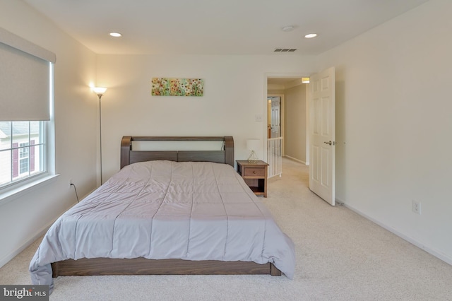 carpeted bedroom with baseboards and recessed lighting