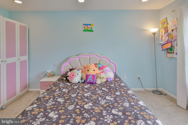 bedroom featuring light carpet, recessed lighting, and baseboards