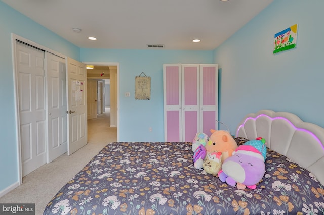 carpeted bedroom with recessed lighting and a closet