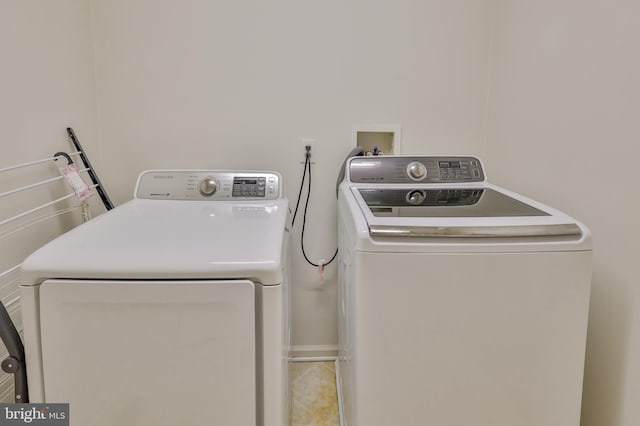 washroom featuring washer and dryer