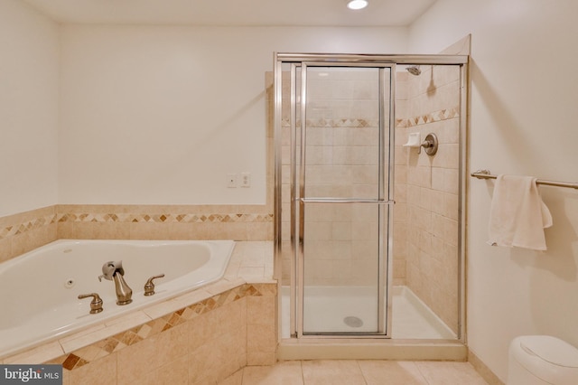full bath featuring tile patterned flooring, a shower stall, a garden tub, recessed lighting, and toilet