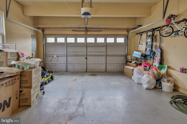 garage featuring a garage door opener and electric panel