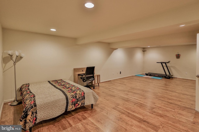bedroom with wood finished floors, recessed lighting, and baseboards