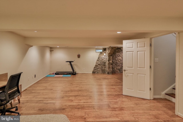 workout area with light wood-type flooring, recessed lighting, and baseboards
