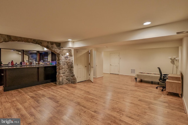 indoor dry bar featuring wood finished floors, recessed lighting, and baseboards