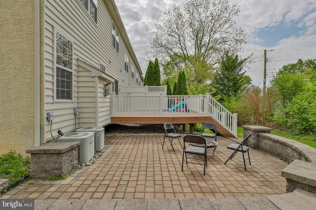 view of patio / terrace featuring central AC unit and a deck