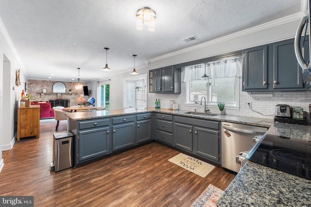 4017 Spring Valley Dr, White Plains, MD 20695 - kitchen with a sink, dishwasher, a peninsula, decorative backsplash, and crown molding