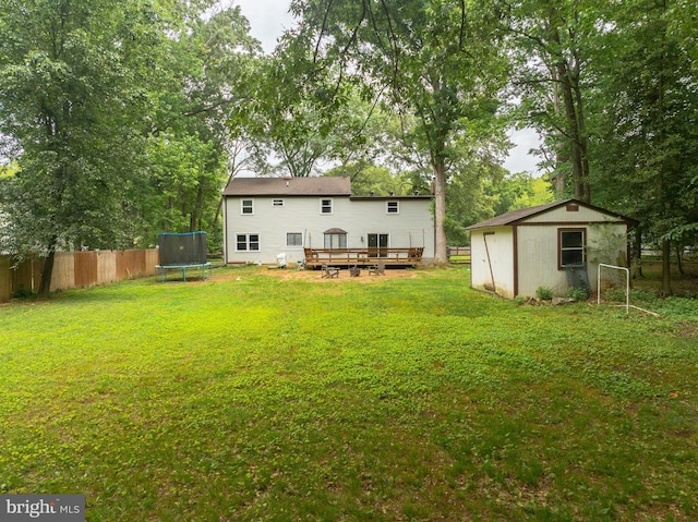 4017 Spring Valley Dr, White Plains, MD 20695 - rear view of property with a trampoline, a deck, an outbuilding, and a shed