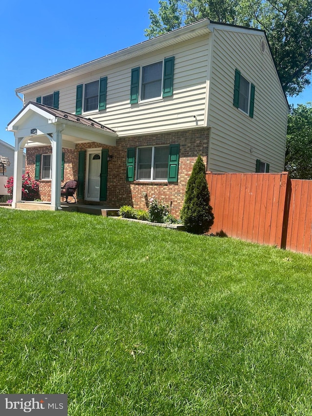 view of front of house featuring brick siding
