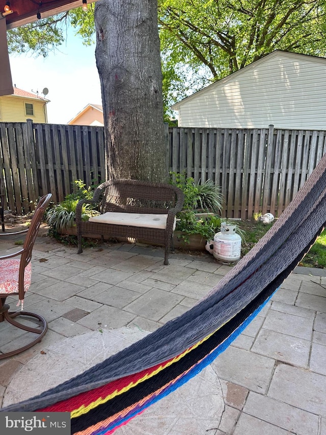 view of patio featuring fence