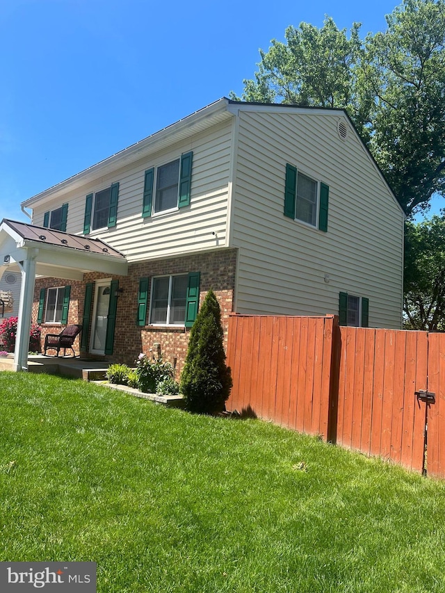 view of front of property featuring brick siding
