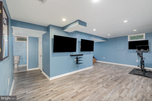 workout room with wood finished floors, baseboards, and recessed lighting