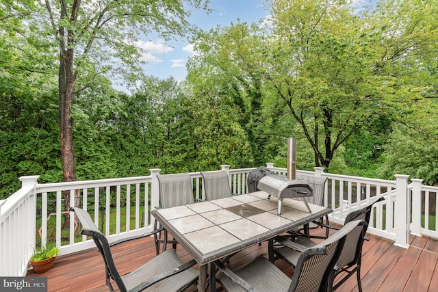 wooden deck with outdoor dining area