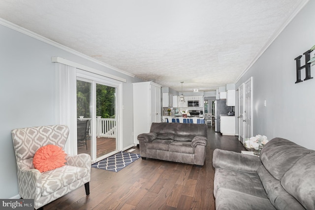 living area with a textured ceiling, dark wood-style flooring, and crown molding