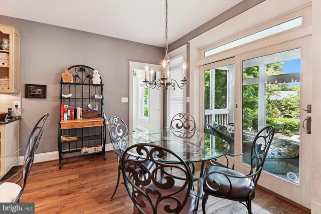 853 Imperial Rd, Arnold, MD 21012 - dining area with a chandelier, plenty of natural light, wood finished floors, and baseboards