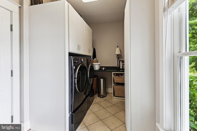 853 Imperial Rd, Arnold, MD 21012 - clothes washing area with washer and dryer, cabinet space, and light tile patterned floors