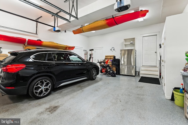 853 Imperial Rd, Arnold, MD 21012 - garage with a garage door opener and freestanding refrigerator