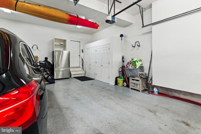 853 Imperial Rd, Arnold, MD 21012 - garage featuring freestanding refrigerator and a garage door opener