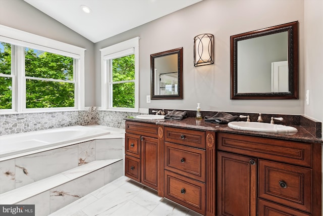 853 Imperial Rd, Arnold, MD 21012 - bathroom with marble finish floors, vaulted ceiling, double vanity, a bath, and recessed lighting