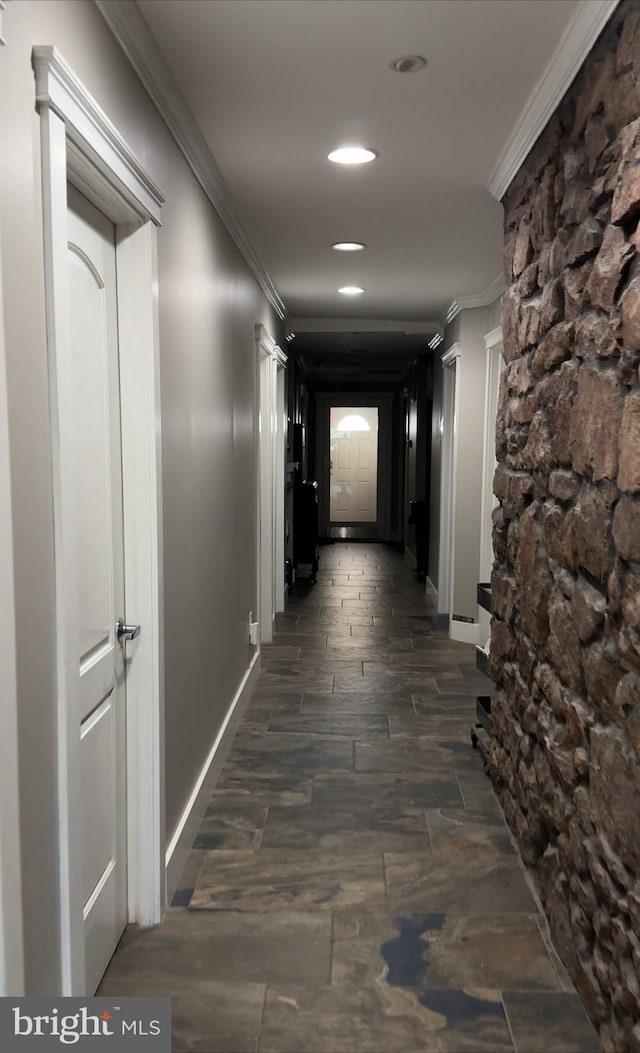 hallway featuring crown molding, recessed lighting, baseboards, and dark wood-style floors
