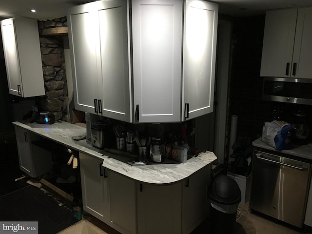 kitchen featuring appliances with stainless steel finishes and light stone countertops