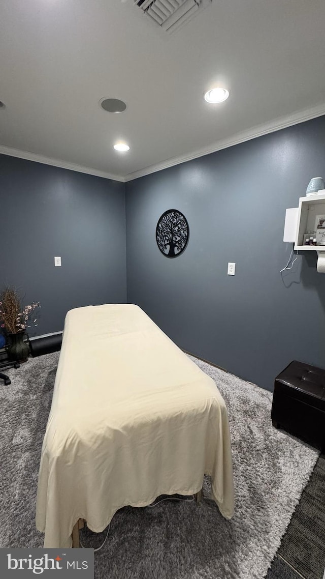 carpeted bedroom featuring crown molding and recessed lighting