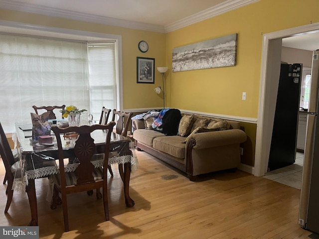 15202 Wetherburn Dr, Centreville, VA 20120 - dining area with light wood-type flooring, ornamental molding, and healthy amount of natural light
