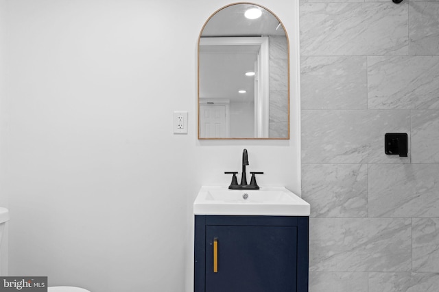 bathroom with vanity and toilet