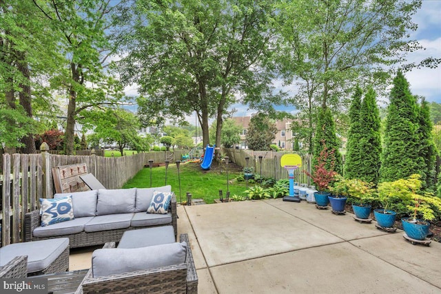 view of patio / terrace featuring an outdoor living space and a playground