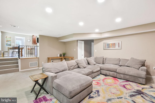 living room with baseboards, carpet, and recessed lighting
