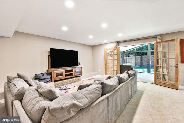 living room with recessed lighting and light colored carpet