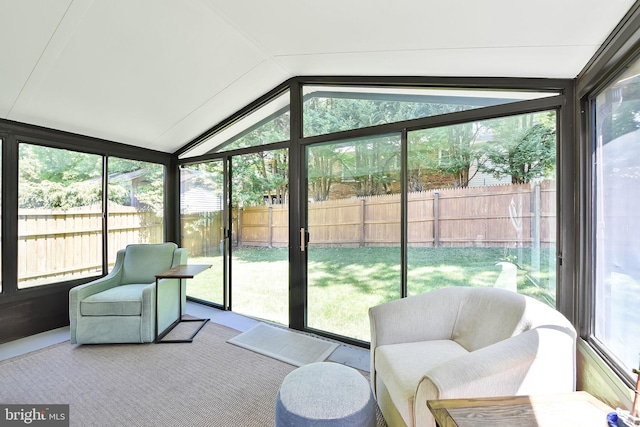 sunroom with lofted ceiling and expansive windows