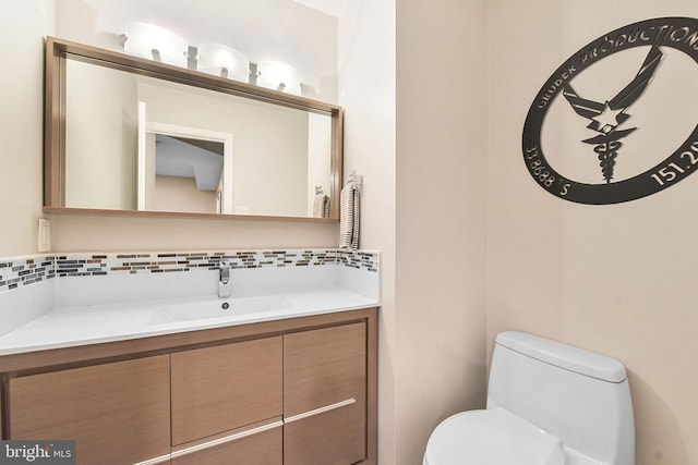 bathroom with toilet and vanity