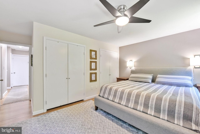 bedroom featuring wood finished floors, baseboards, a closet, and ceiling fan