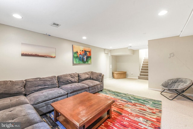 carpeted living area with stairway, recessed lighting, and baseboards