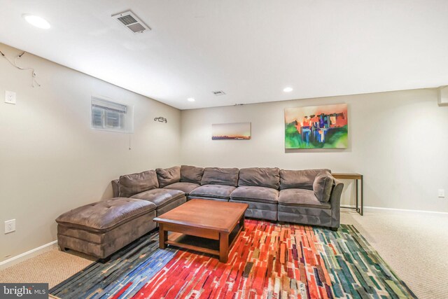 living room with baseboards, recessed lighting, and carpet