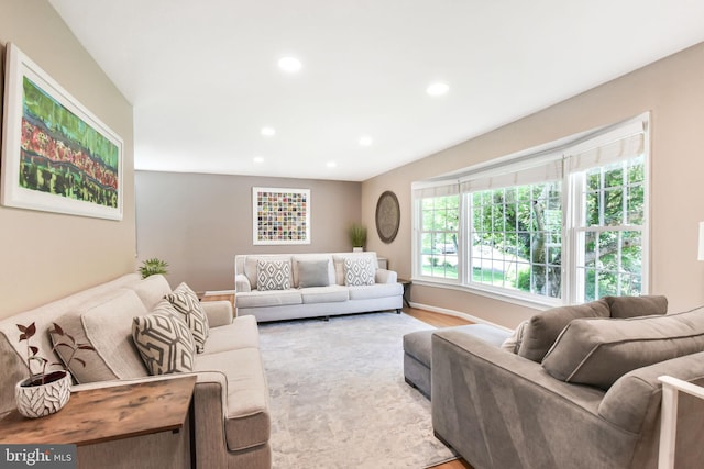 living area with recessed lighting and wood finished floors