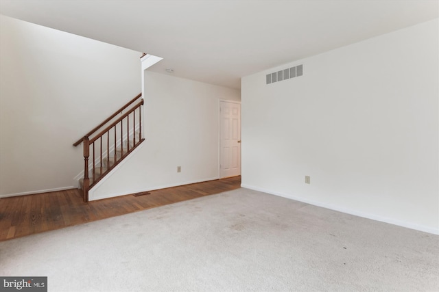 389 Mattapany Ct, Arnold, MD 21012 - unfurnished living room featuring carpet flooring, stairway, and baseboards