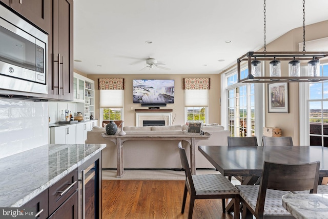 1123 Riverview Ln, Conshohocken, PA 19428 - kitchen with stainless steel microwave, beverage cooler, healthy amount of natural light, light wood finished floors, and recessed lighting