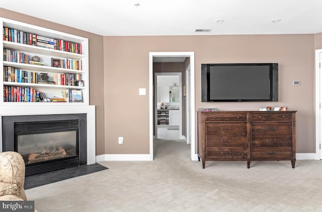 1123 Riverview Ln, Conshohocken, PA 19428 - carpeted living area featuring baseboards, a fireplace with flush hearth, and built in features