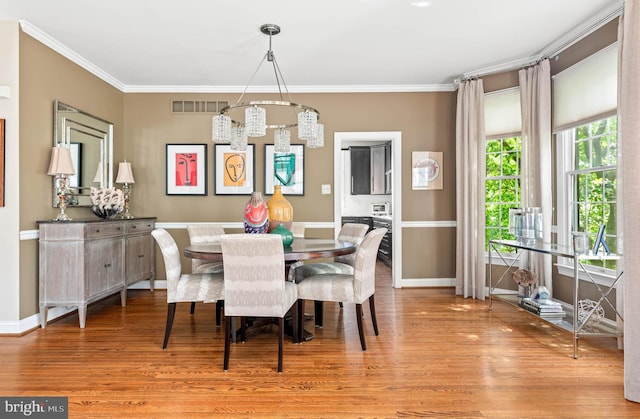 1123 Riverview Ln, Conshohocken, PA 19428 - dining area with a chandelier, wood finished floors, baseboards, and ornamental molding