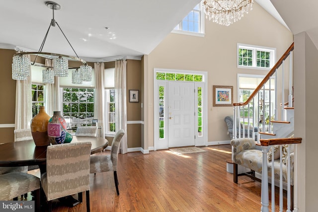 1123 Riverview Ln, Conshohocken, PA 19428 - entryway featuring a chandelier, baseboards, wood finished floors, and stairs