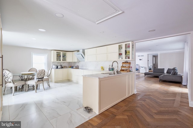 kitchen with glass insert cabinets, extractor fan, backsplash, white cabinets, and recessed lighting