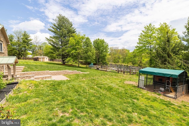 view of yard with an outbuilding and exterior structure