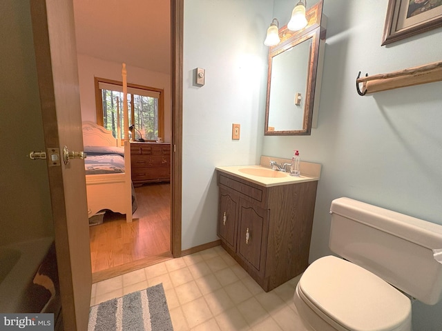 bathroom with toilet and vanity