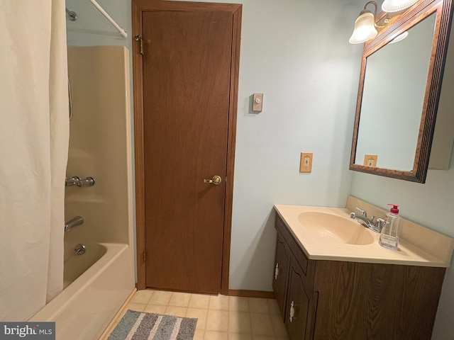 full bathroom with shower / tub combo, vanity, tile patterned floors, and baseboards