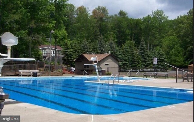 community pool featuring fence